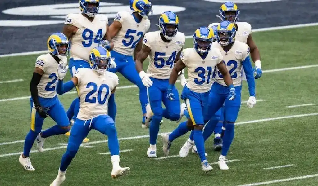 Los Angeles Rams players celebrate on the field during the 2021 NFL season.
