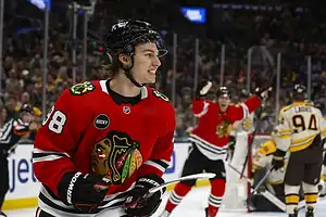 Chicago Blackhawks player #88, smiling after scoring a goal.