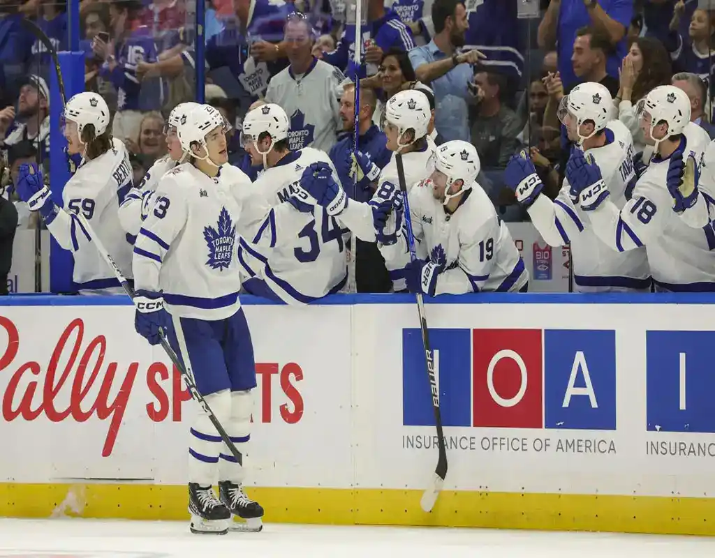 Toronto Maple Leafs players celebrate a goal at the bench during a game against the Washington Capitals