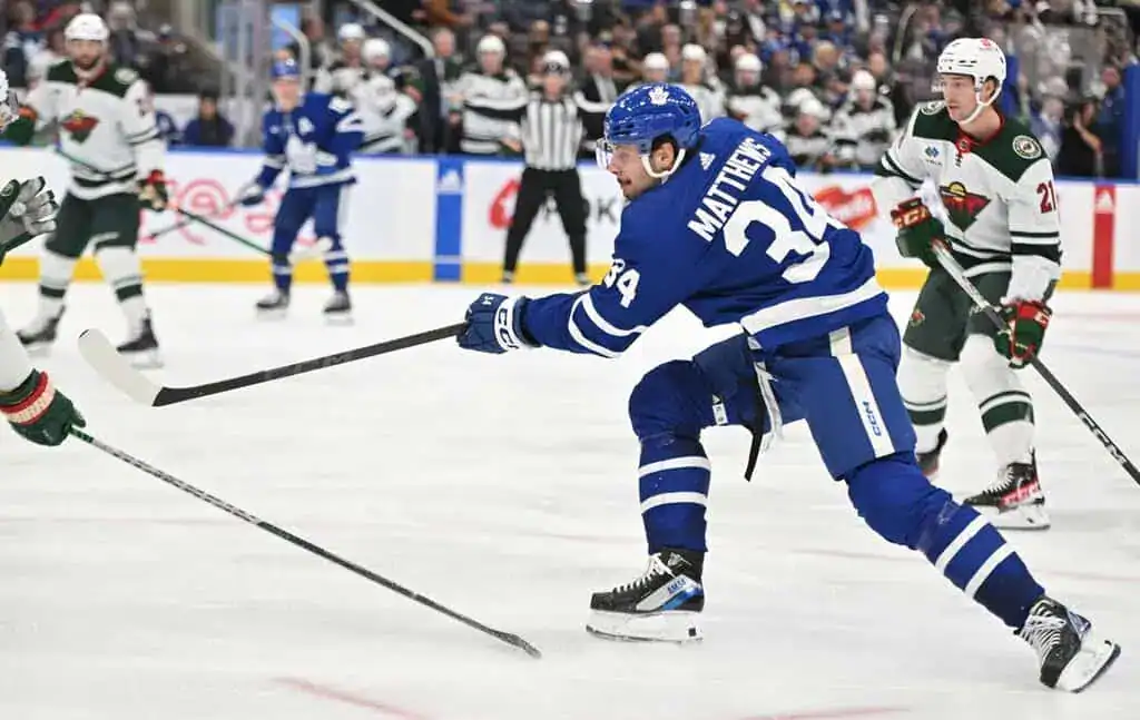 Toronto Maple Leafs forward Auston Matthews takes a shot on goal against the Minnesota Wild defense.