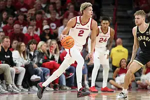 Arkansas Razorbacks basketball player #2 dribbling the ball during a game.