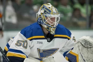 A St. Louis Blues goalie, stays focused in net during an NHL game.