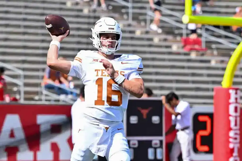 Texas Longhorns quarterback throws a pass during a college football game.