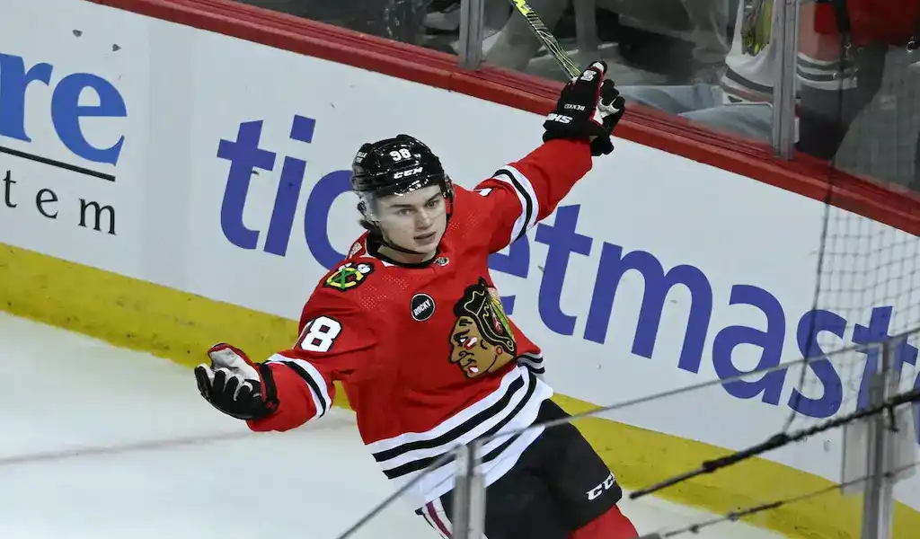 NHL 6 Chicago Blackhawks player celebrates after scoring a goal against the New Jersey Devils during an NHL game.