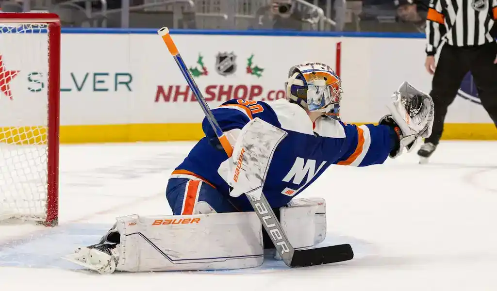 NHL 3 New York Islanders goalie makes a save during a November 28, 2023, NHL game against the New Jersey Devils.