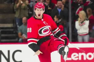 This image captures an electrifying moment from a Carolina Hurricanes game.