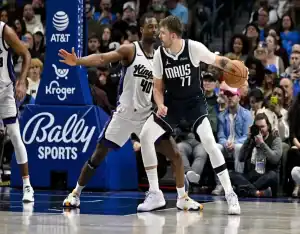 Luka Dončić of the Dallas Mavericks backs down defender from Sacramento Kings during NBA game