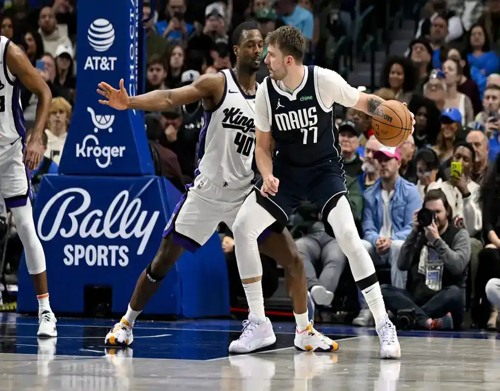 Luka Dončić of the Dallas Mavericks backs down defender from Sacramento Kings during NBA game