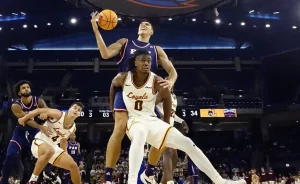 A Loyola basketball player positions himself for a rebound.