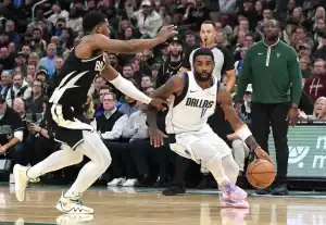 Kyrie Irving of the Dallas Mavericks drives past a defender during an NBA game