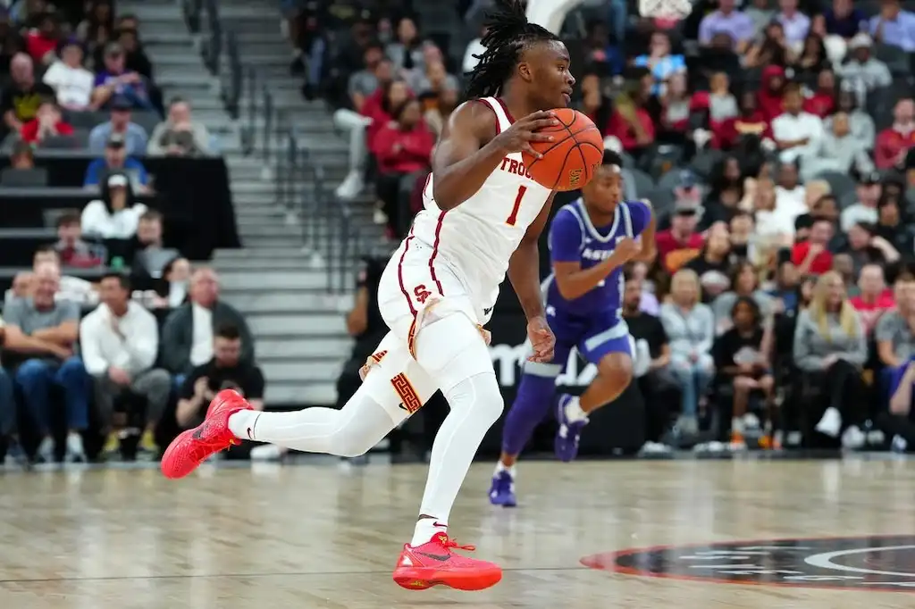 NCAAB 2 Southern California Trojans sprints with the ball during a fast break.