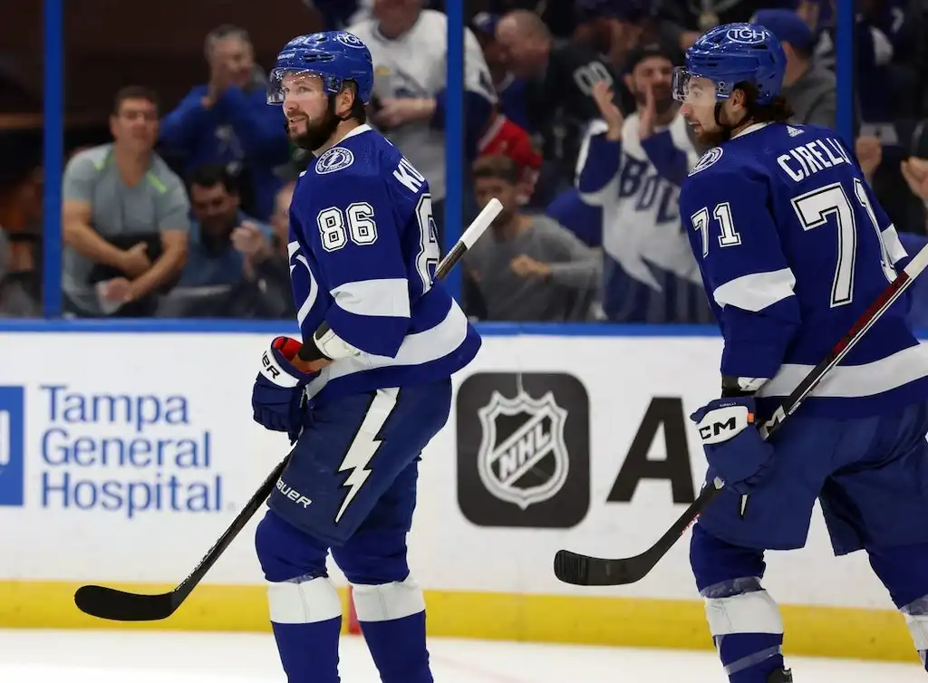 Tampa Bay Lightning players celebrate on the ice during an NHL game.