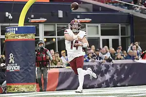 Washington Commanders quarterback Sam Howell throws a pass during a game.
