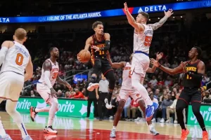 atlanta and new york basketball players facing off in the court