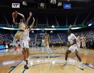 Georgia Tech Yellow Jackets player goes up for a layup against the UMass Lowell River Hawks during their November 14, 2023, matchup.