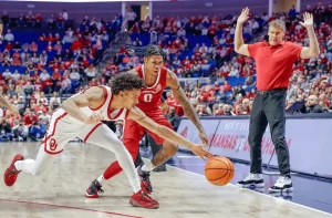 College basketball matchup between the Arkansas Razorbacks and Lipscomb Bison with expert pick and prediction for December 16th 2023.