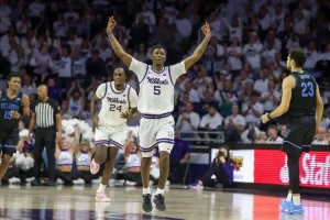 Kansas State Wildcats basketball players celebrate during a game against the Villanova Wildcats