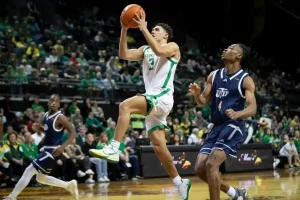Oregon player elevates for a layup.