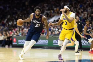 A Philadelphia basketball player drives toward the basket.