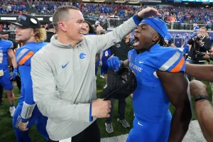 boise state player with coach