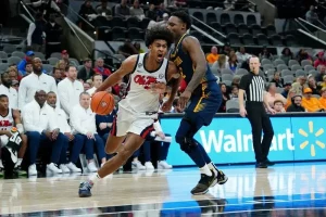 missisipi player confronting rival player with the ball
