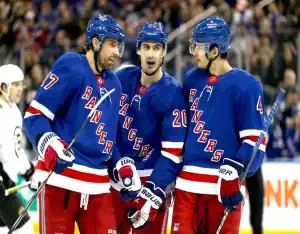 New York Rangers players huddle during a game against the Anaheim Ducks on December 15, 2023