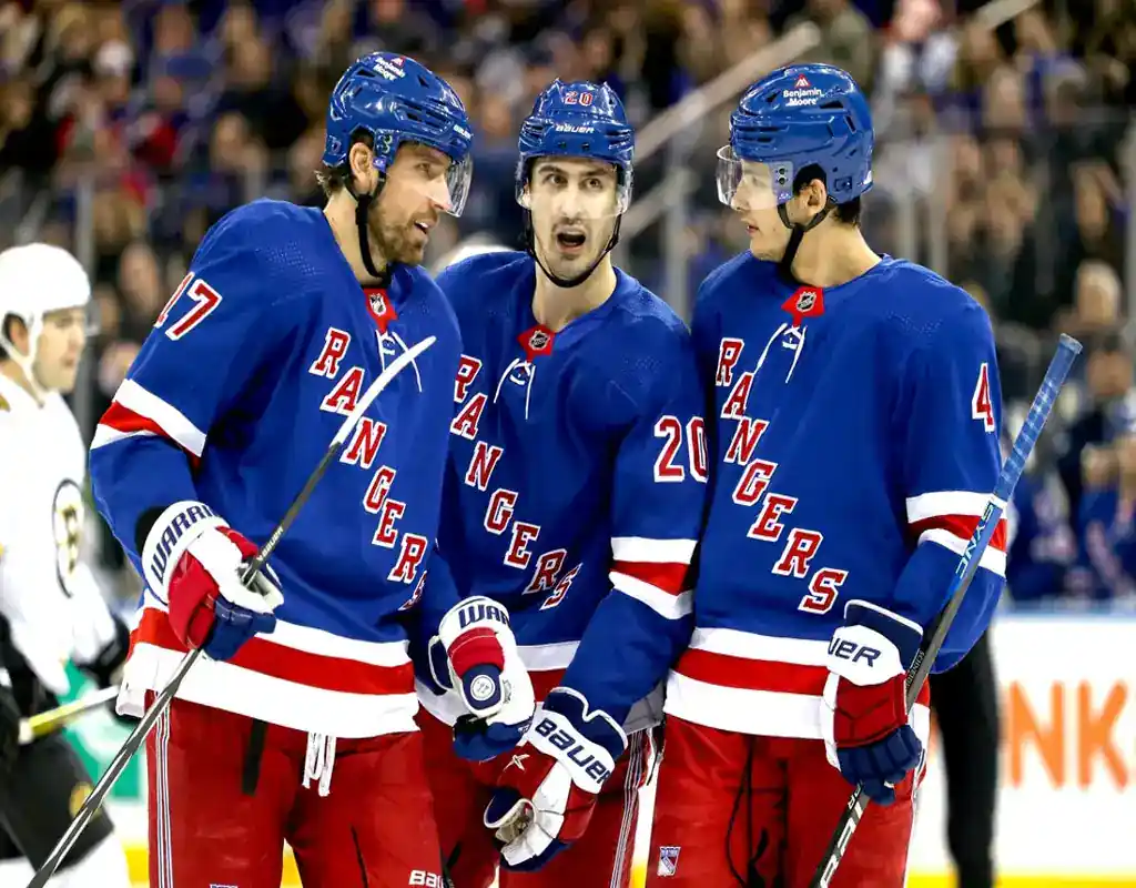 New York Rangers players huddle during a game against the Anaheim Ducks on December 15, 2023