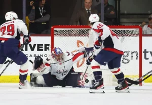 washington capitals goalie trying to block a goal