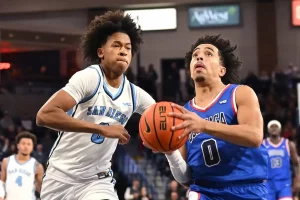 A Gonzaga player drives toward the basket with determination.