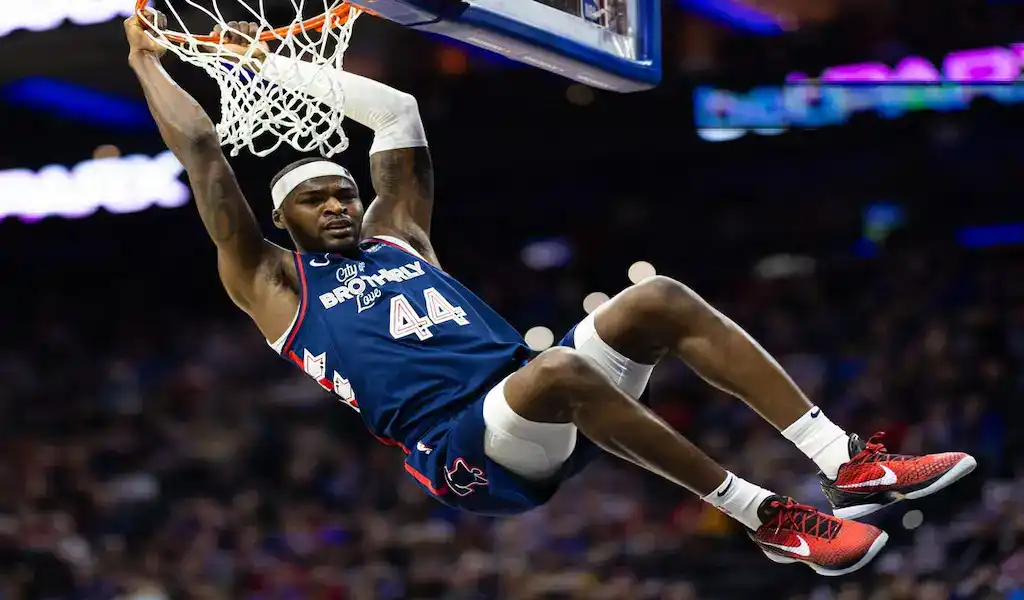 Philadelphia 76ers player hangs from rim after slam dunk against Atlanta Hawks