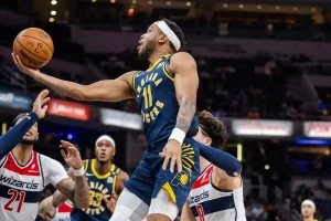 Indiana Pacers player drives to the basket for a layup.