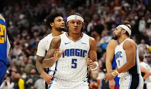Orlando Magic player celebrates after a play during an NBA game against the Atlanta Hawks.
