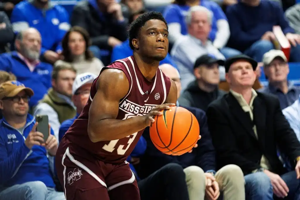 NCAAB 8 A Mississippi State basketball player prepares to shoot the ball.
