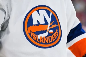 New York Islanders logo on a white hockey jersey.