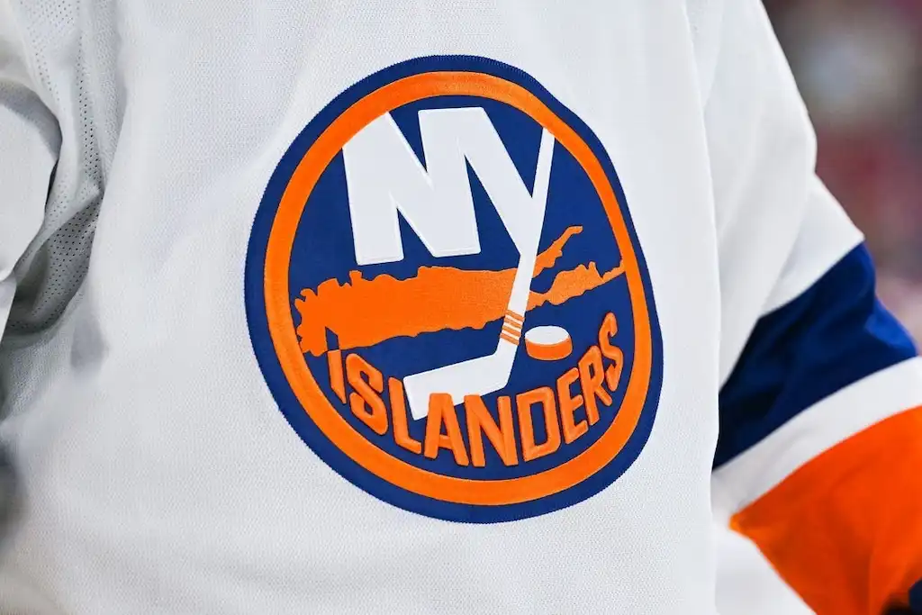 New York Islanders logo on a white hockey jersey.