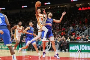 basketball players facing each other in a play