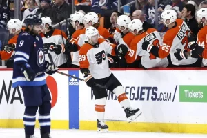 flyers player being saluted by his teammates