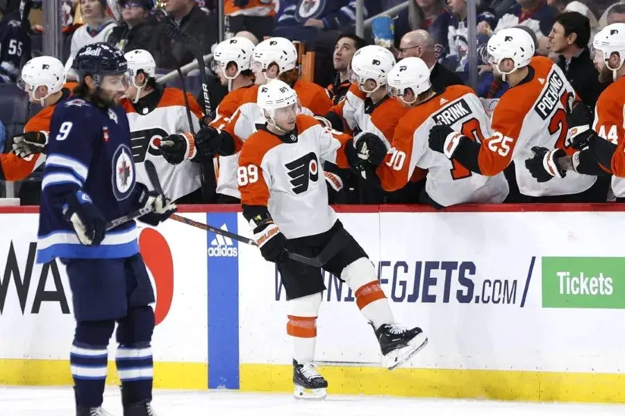 flyers player being saluted by his teammates
