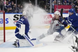 hockey player facing goalie