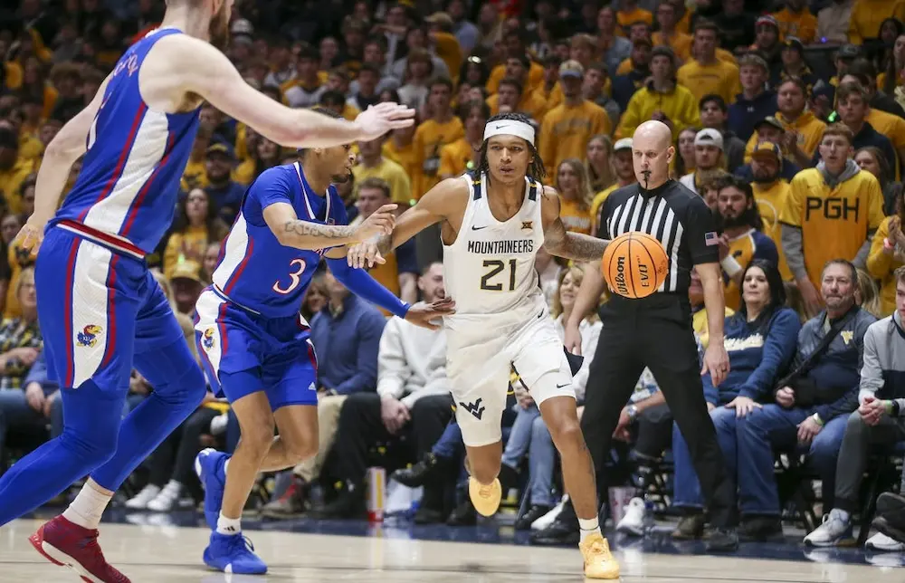 mountaineers ncaab player dribbling