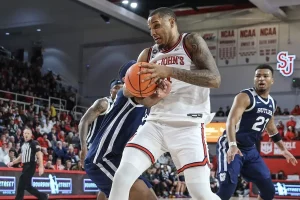 st johns ncaab player holding the ball