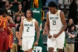 Two Baylor players celebrate after play.