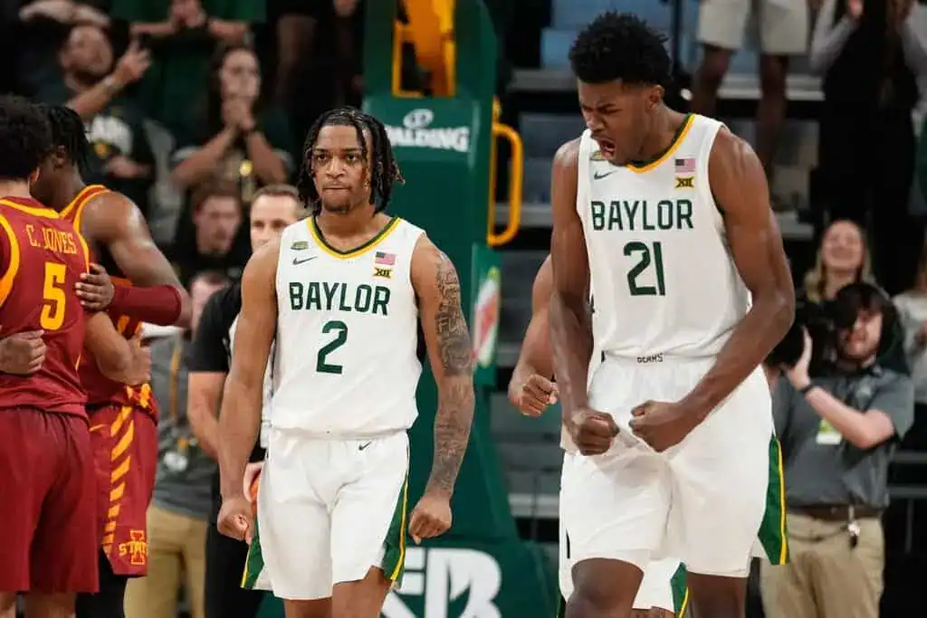 Two Baylor players celebrate after play.
