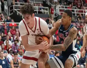 Arizona Wildcats and Stanford Cardinal players battle for possession during college basketball game