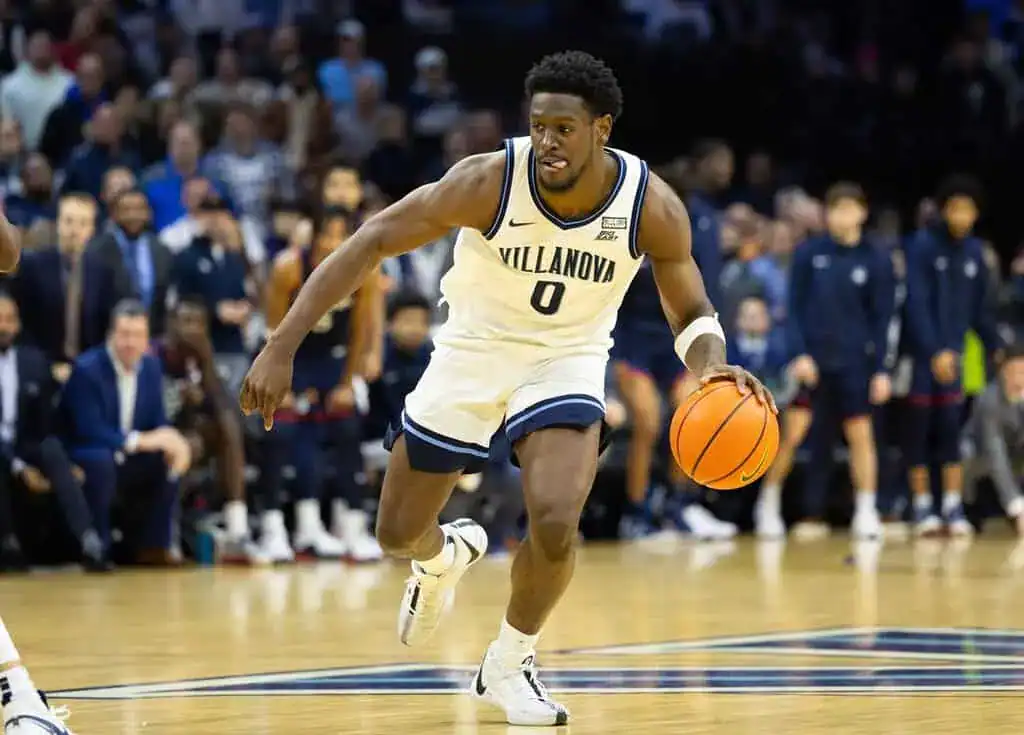 Villanova player wearing number 0 dribbles the ball down the court during a game.