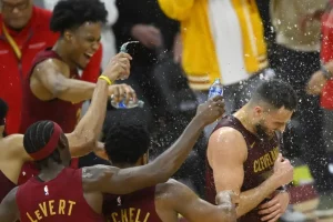 Cleveland Cavaliers players celebrate on the court.
