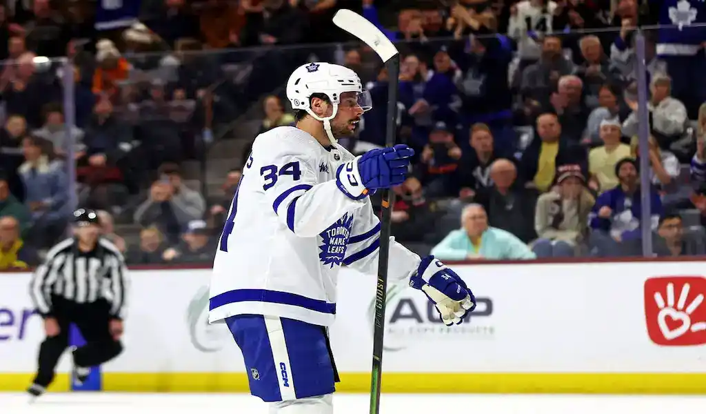 A Toronto Maple Leafs player celebrates a goal during an NHL game against the Vegas Golden Knights on February 22, 2024.