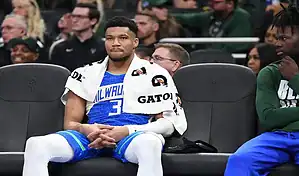 Milwaukee Bucks player Giannis Antetokounmpo sits on the bench during a game against the Memphis Grizzlies on February 15, 2024.