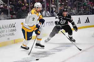 Nashville Predators player controls puck against LA Kings.