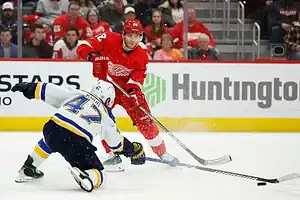 Redwings player dribbling passed player